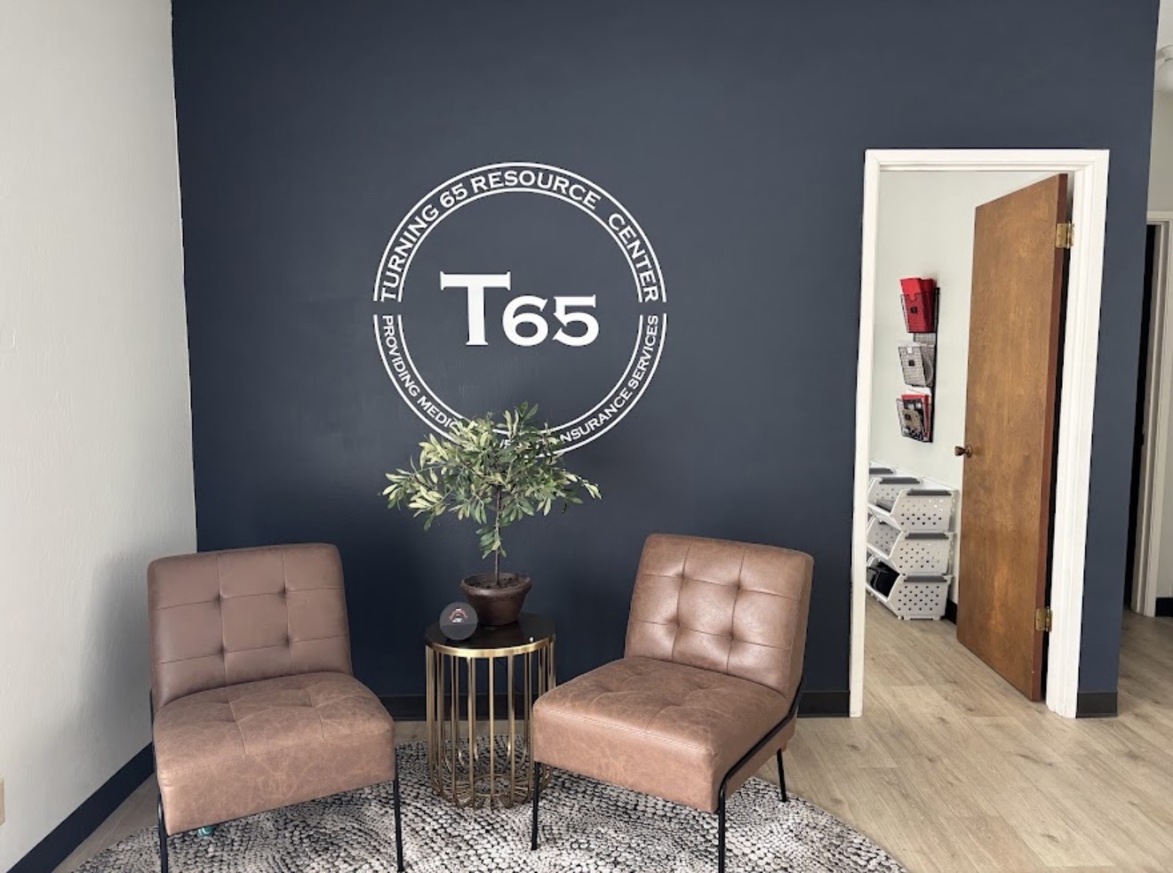 Turning 65 Resource Center Napa lobby with T65 logo wall